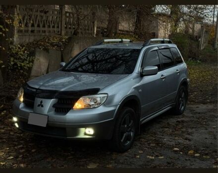 Серый Мицубиси Аутлендер, объемом двигателя 2.4 л и пробегом 282 тыс. км за 7500 $, фото 1 на Automoto.ua