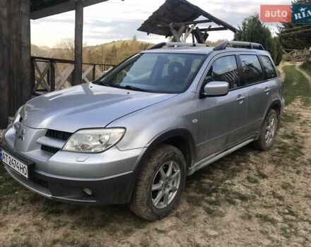 Серый Мицубиси Аутлендер, объемом двигателя 2.38 л и пробегом 241 тыс. км за 5500 $, фото 1 на Automoto.ua