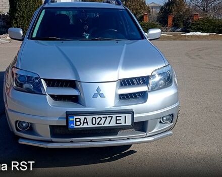Серый Мицубиси Аутлендер, объемом двигателя 2.4 л и пробегом 161 тыс. км за 6500 $, фото 1 на Automoto.ua
