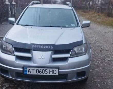 Серый Мицубиси Аутлендер, объемом двигателя 2.4 л и пробегом 261 тыс. км за 5700 $, фото 1 на Automoto.ua