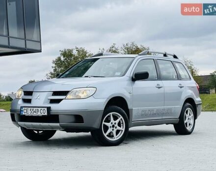Серый Мицубиси Аутлендер, объемом двигателя 2 л и пробегом 300 тыс. км за 5150 $, фото 1 на Automoto.ua
