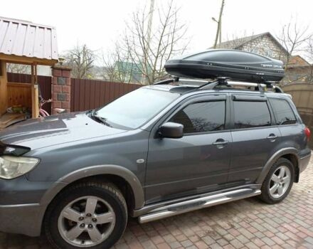 Серый Мицубиси Аутлендер, объемом двигателя 2.4 л и пробегом 240 тыс. км за 7000 $, фото 1 на Automoto.ua