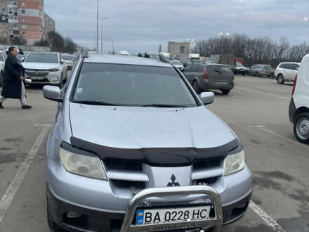 Серый Мицубиси Аутлендер, объемом двигателя 2.4 л и пробегом 307 тыс. км за 4000 $, фото 1 на Automoto.ua