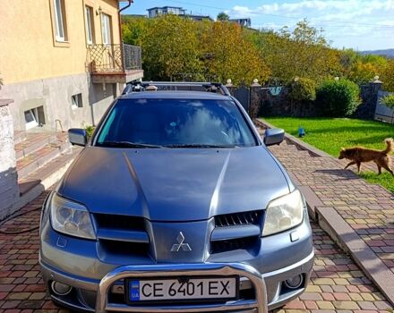 Серый Мицубиси Аутлендер, объемом двигателя 2.4 л и пробегом 576 тыс. км за 5800 $, фото 1 на Automoto.ua