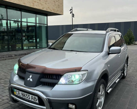 Серый Мицубиси Аутлендер, объемом двигателя 2.38 л и пробегом 180 тыс. км за 6000 $, фото 1 на Automoto.ua