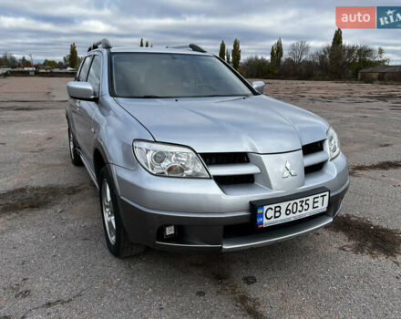 Серый Мицубиси Аутлендер, объемом двигателя 2.4 л и пробегом 264 тыс. км за 6300 $, фото 1 на Automoto.ua