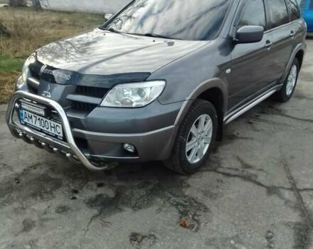 Серый Мицубиси Аутлендер, объемом двигателя 2 л и пробегом 154 тыс. км за 6500 $, фото 1 на Automoto.ua