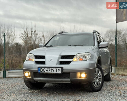 Серый Мицубиси Аутлендер, объемом двигателя 2.38 л и пробегом 204 тыс. км за 6990 $, фото 1 на Automoto.ua