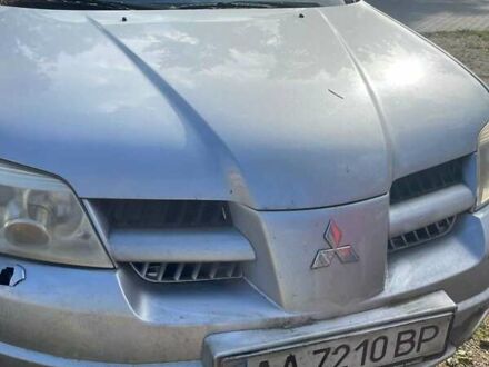 Серый Мицубиси Аутлендер, объемом двигателя 2.4 л и пробегом 127 тыс. км за 4400 $, фото 1 на Automoto.ua