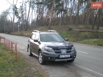 Серый Мицубиси Аутлендер, объемом двигателя 2.4 л и пробегом 235 тыс. км за 6500 $, фото 1 на Automoto.ua