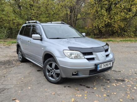 Серый Мицубиси Аутлендер, объемом двигателя 2.4 л и пробегом 230 тыс. км за 6700 $, фото 1 на Automoto.ua