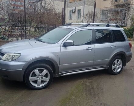 Серый Мицубиси Аутлендер, объемом двигателя 2.4 л и пробегом 240 тыс. км за 7300 $, фото 1 на Automoto.ua