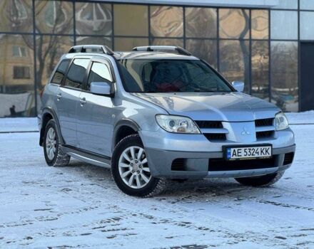 Серый Мицубиси Аутлендер, объемом двигателя 2.4 л и пробегом 286 тыс. км за 5699 $, фото 1 на Automoto.ua