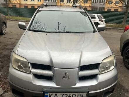 Серый Мицубиси Аутлендер, объемом двигателя 2.4 л и пробегом 179 тыс. км за 7000 $, фото 1 на Automoto.ua