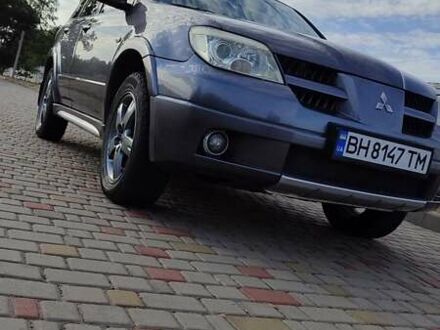 Сірий Міцубісі Аутлендер, об'ємом двигуна 2.38 л та пробігом 189 тис. км за 7600 $, фото 1 на Automoto.ua