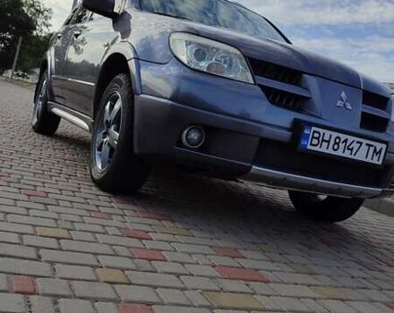Серый Мицубиси Аутлендер, объемом двигателя 2.38 л и пробегом 189 тыс. км за 7600 $, фото 1 на Automoto.ua
