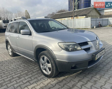 Сірий Міцубісі Аутлендер, об'ємом двигуна 2.4 л та пробігом 166 тис. км за 6700 $, фото 1 на Automoto.ua