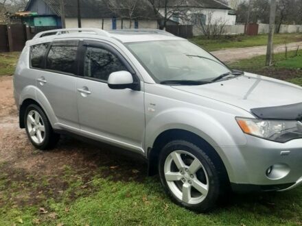 Серый Мицубиси Аутлендер, объемом двигателя 3 л и пробегом 183 тыс. км за 9200 $, фото 1 на Automoto.ua