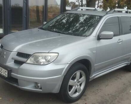 Серый Мицубиси Аутлендер, объемом двигателя 2.38 л и пробегом 200 тыс. км за 6550 $, фото 1 на Automoto.ua