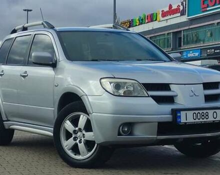 Серый Мицубиси Аутлендер, объемом двигателя 2.4 л и пробегом 170 тыс. км за 6400 $, фото 1 на Automoto.ua