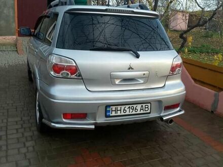 Серый Мицубиси Аутлендер, объемом двигателя 2 л и пробегом 268 тыс. км за 7500 $, фото 1 на Automoto.ua