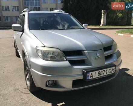 Серый Мицубиси Аутлендер, объемом двигателя 2.38 л и пробегом 182 тыс. км за 6000 $, фото 1 на Automoto.ua