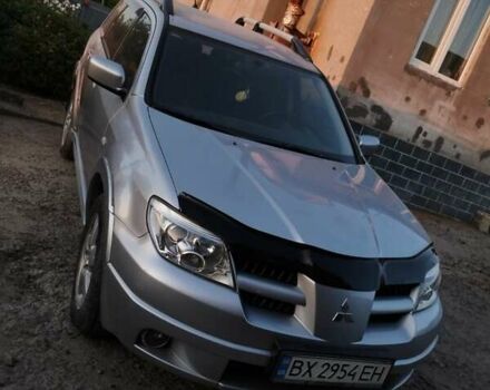 Серый Мицубиси Аутлендер, объемом двигателя 2.4 л и пробегом 117 тыс. км за 7950 $, фото 1 на Automoto.ua