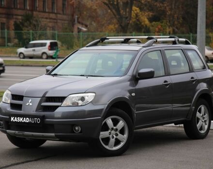 Серый Мицубиси Аутлендер, объемом двигателя 2.4 л и пробегом 240 тыс. км за 7200 $, фото 1 на Automoto.ua
