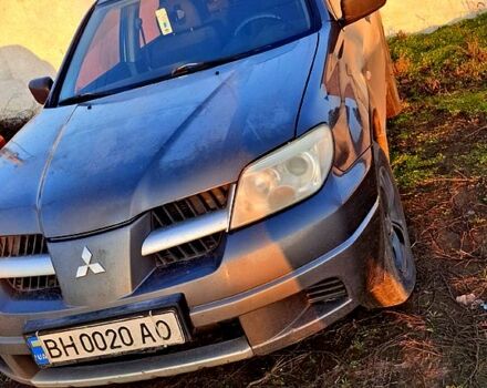 Серый Мицубиси Аутлендер, объемом двигателя 2.4 л и пробегом 211 тыс. км за 5000 $, фото 1 на Automoto.ua