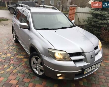 Серый Мицубиси Аутлендер, объемом двигателя 2.4 л и пробегом 167 тыс. км за 6400 $, фото 1 на Automoto.ua