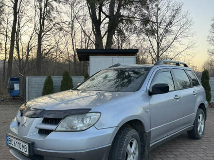 Серый Мицубиси Аутлендер, объемом двигателя 2 л и пробегом 415 тыс. км за 4699 $, фото 1 на Automoto.ua