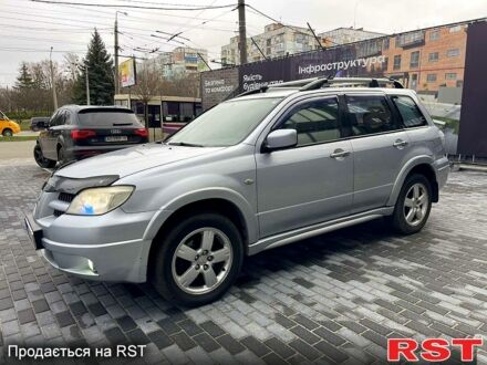 Серый Мицубиси Аутлендер, объемом двигателя 2.4 л и пробегом 280 тыс. км за 5800 $, фото 1 на Automoto.ua