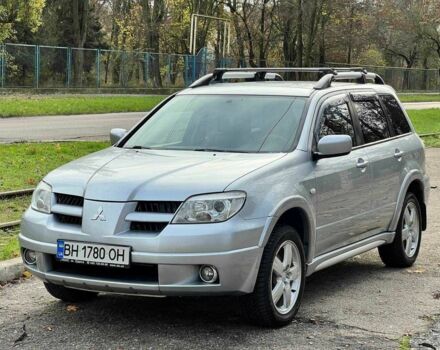 Серый Мицубиси Аутлендер, объемом двигателя 2.4 л и пробегом 170 тыс. км за 6900 $, фото 1 на Automoto.ua