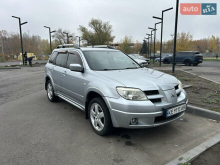 Серый Мицубиси Аутлендер, объемом двигателя 2.38 л и пробегом 81 тыс. км за 8700 $, фото 1 на Automoto.ua