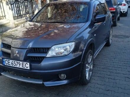 Серый Мицубиси Аутлендер, объемом двигателя 2 л и пробегом 176 тыс. км за 5400 $, фото 1 на Automoto.ua