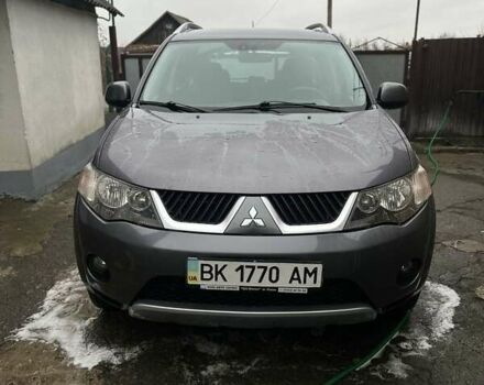 Серый Мицубиси Аутлендер, объемом двигателя 2.4 л и пробегом 238 тыс. км за 7200 $, фото 1 на Automoto.ua