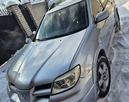 Серый Мицубиси Аутлендер, объемом двигателя 2.4 л и пробегом 250 тыс. км за 7770 $, фото 1 на Automoto.ua