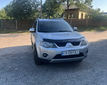 Серый Мицубиси Аутлендер, объемом двигателя 2.36 л и пробегом 245 тыс. км за 9300 $, фото 1 на Automoto.ua