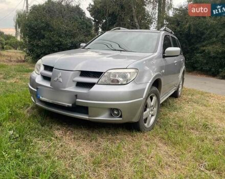 Сірий Міцубісі Аутлендер, об'ємом двигуна 2.38 л та пробігом 209 тис. км за 7460 $, фото 1 на Automoto.ua