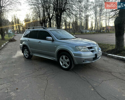 Серый Мицубиси Аутлендер, объемом двигателя 2.4 л и пробегом 320 тыс. км за 6000 $, фото 1 на Automoto.ua