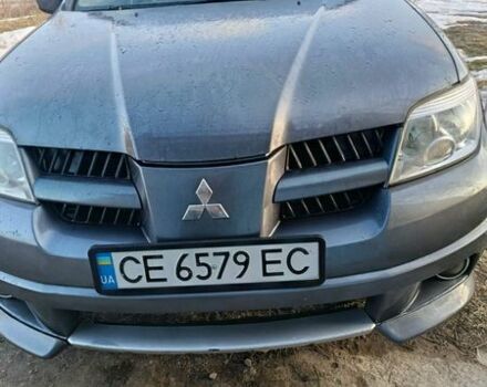 Серый Мицубиси Аутлендер, объемом двигателя 2 л и пробегом 178 тыс. км за 5700 $, фото 1 на Automoto.ua
