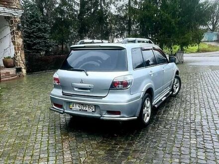 Сірий Міцубісі Аутлендер, об'ємом двигуна 2 л та пробігом 200 тис. км за 5800 $, фото 1 на Automoto.ua