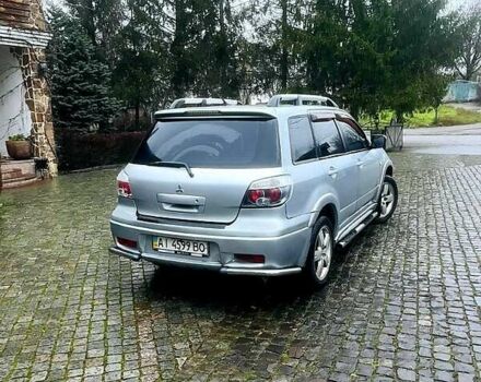 Серый Мицубиси Аутлендер, объемом двигателя 2 л и пробегом 200 тыс. км за 5800 $, фото 1 на Automoto.ua