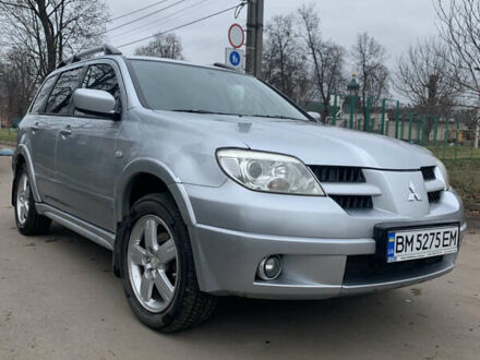 Серый Мицубиси Аутлендер, объемом двигателя 2 л и пробегом 247 тыс. км за 5999 $, фото 1 на Automoto.ua