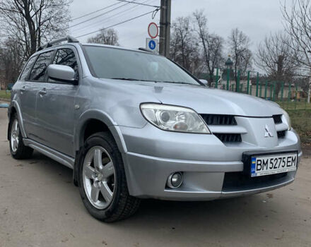Серый Мицубиси Аутлендер, объемом двигателя 2 л и пробегом 247 тыс. км за 5999 $, фото 1 на Automoto.ua