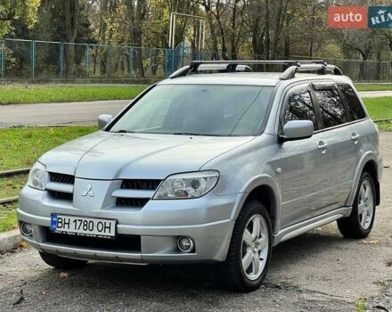 Серый Мицубиси Аутлендер, объемом двигателя 2.38 л и пробегом 170 тыс. км за 6900 $, фото 1 на Automoto.ua