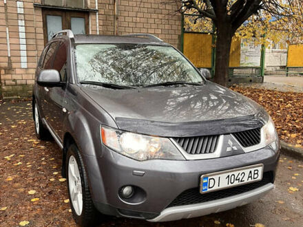 Серый Мицубиси Аутлендер, объемом двигателя 3 л и пробегом 209 тыс. км за 9800 $, фото 1 на Automoto.ua