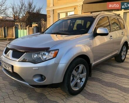 Серый Мицубиси Аутлендер, объемом двигателя 2.36 л и пробегом 210 тыс. км за 8499 $, фото 1 на Automoto.ua