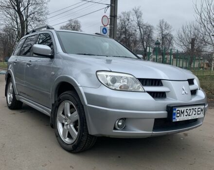 Серый Мицубиси Аутлендер, объемом двигателя 2 л и пробегом 247 тыс. км за 5999 $, фото 1 на Automoto.ua