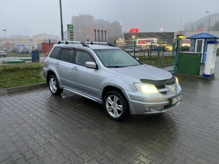 Серый Мицубиси Аутлендер, объемом двигателя 2.4 л и пробегом 299 тыс. км за 6300 $, фото 1 на Automoto.ua